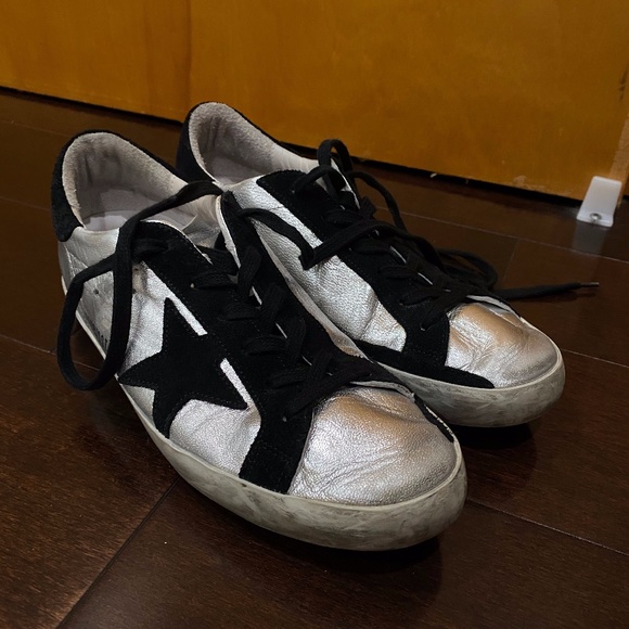 silver and black golden goose